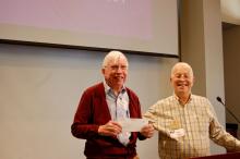 Kirby Kemper receiving $100 award from AROHE as gift to ARF from Tom Hart